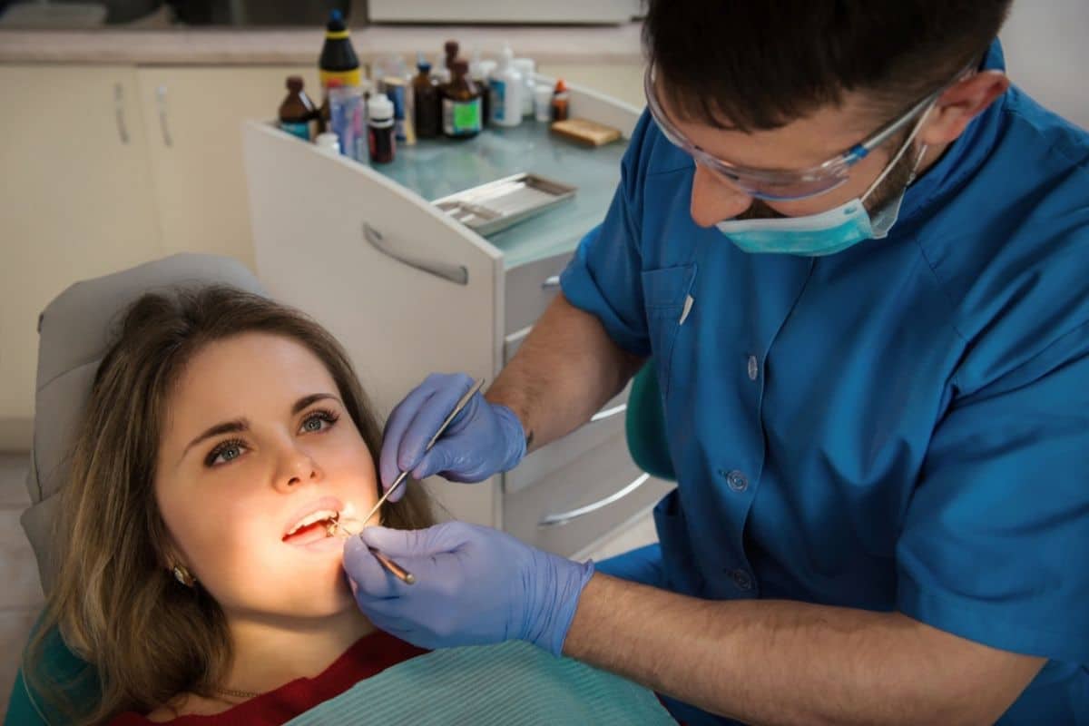 General dentist examining a patient's teeth during a routine check-up in Rio Rancho.