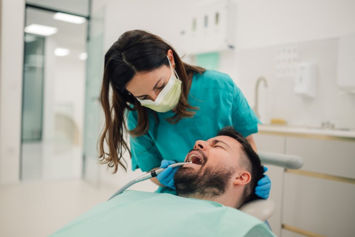 Patient receiving a dental cleaning Patient receiving a dental cleaning from a dentist in Rio Rancho.