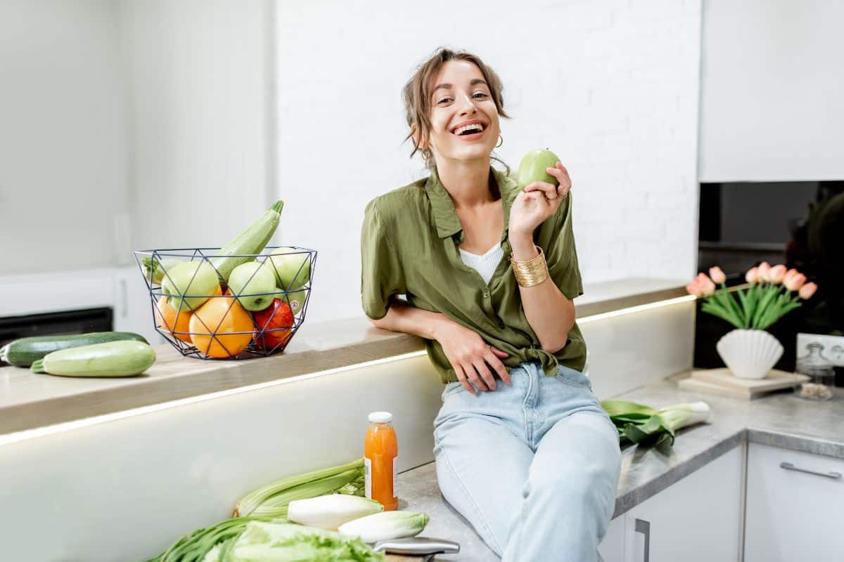 Smiling Face A woman is smiling with healthy diet choices for improved oral health.